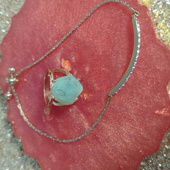 Gold Ring with Green Stone and Bracket - Picture 1 of 3